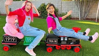 Jannie and Charlotte Play with Toy Trains