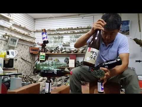 Balanced bottle sculptures by balancing artist Rocky Byun