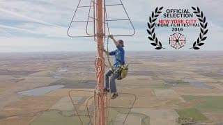Changing a light bulb at the top of a fifteenhundred foot TV tower