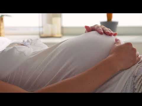 Baby moving inside belly of pregnant woman