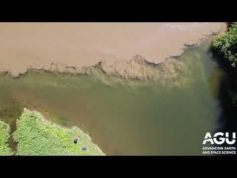 Watery tornadoes where two rivers collide