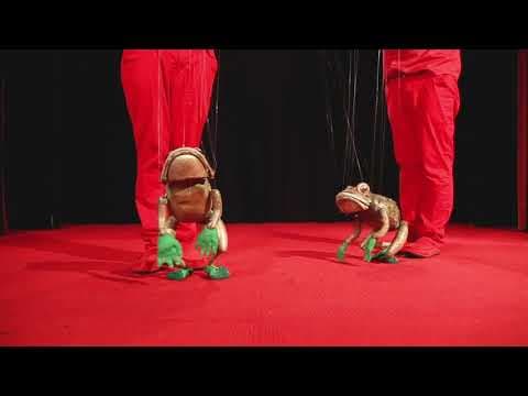 Two marionette frogs perform Shine On Harvest Moon
